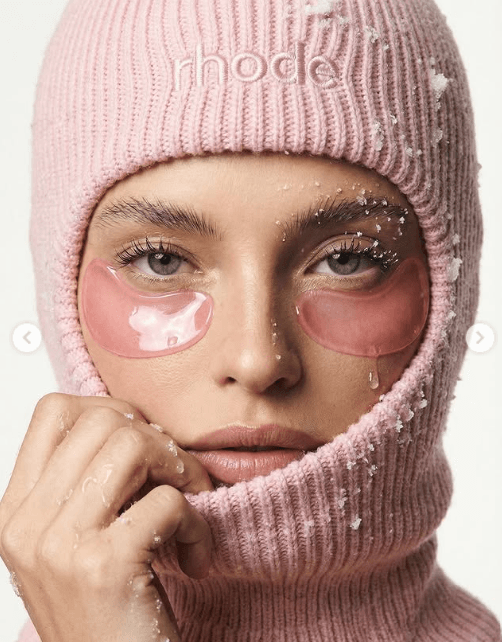 AI-generated renders inspired by the aesthetic of the Rhode campaign, featuring a pink color palette, soft lighting, and an editorial beauty style.